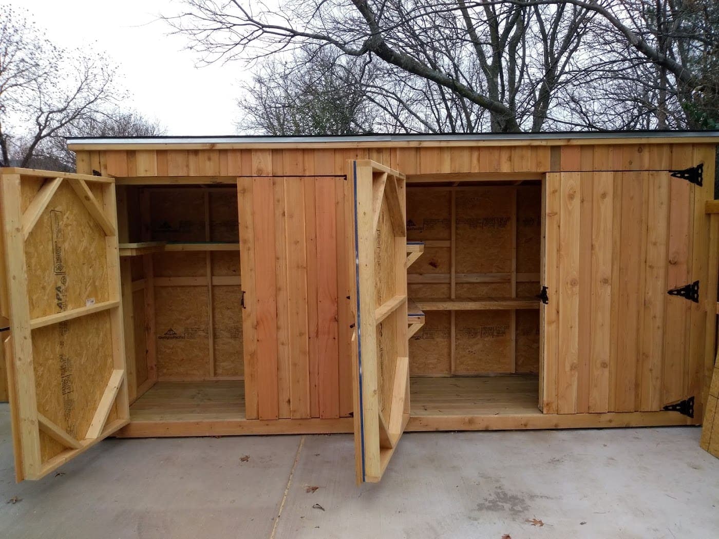 Custom cedar storage cabinet with the doors open