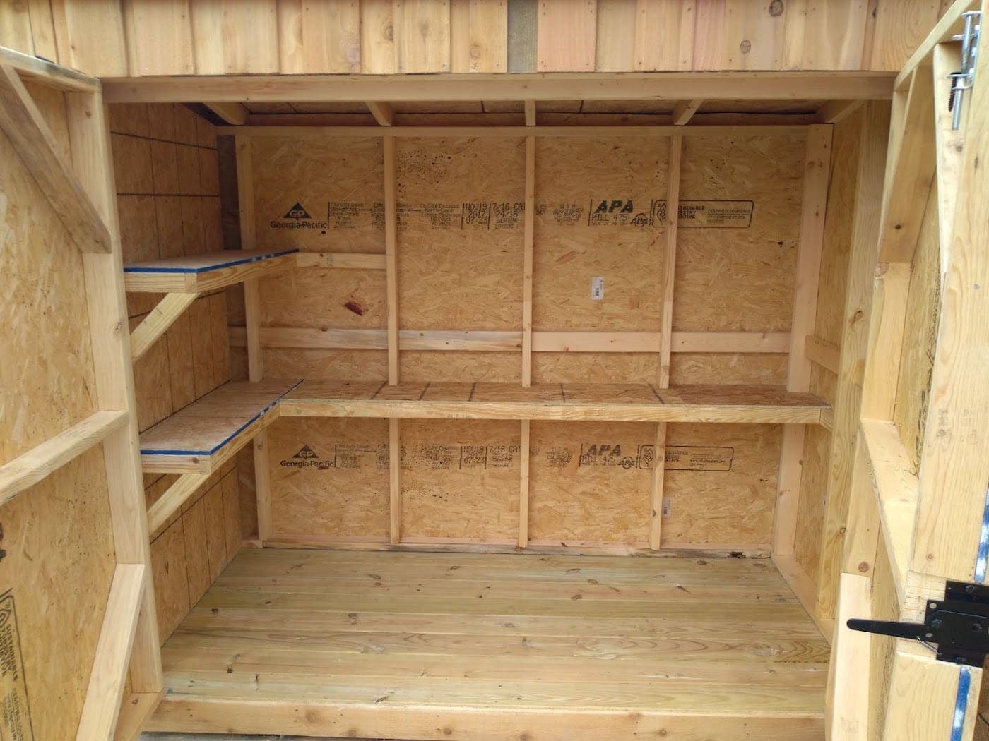 Built-in shelving inside a custom storage building