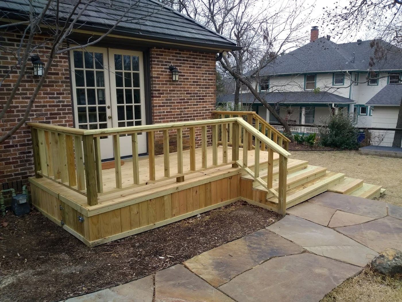 Deck with railing built off a set of french doors