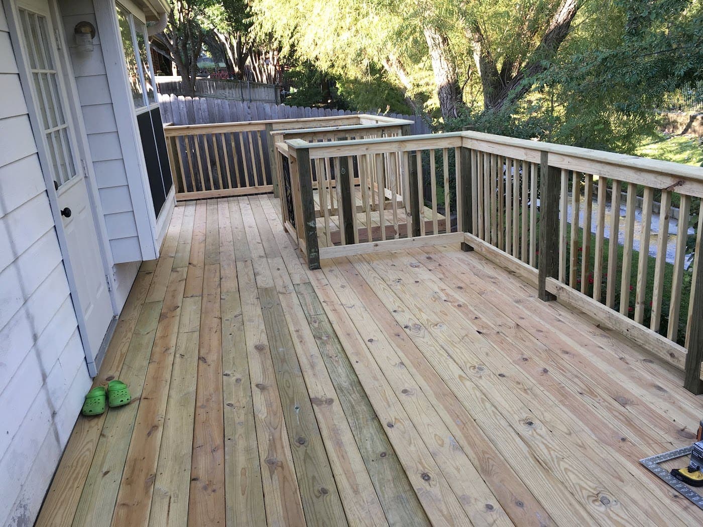 Deck with full railing off the back of a home
