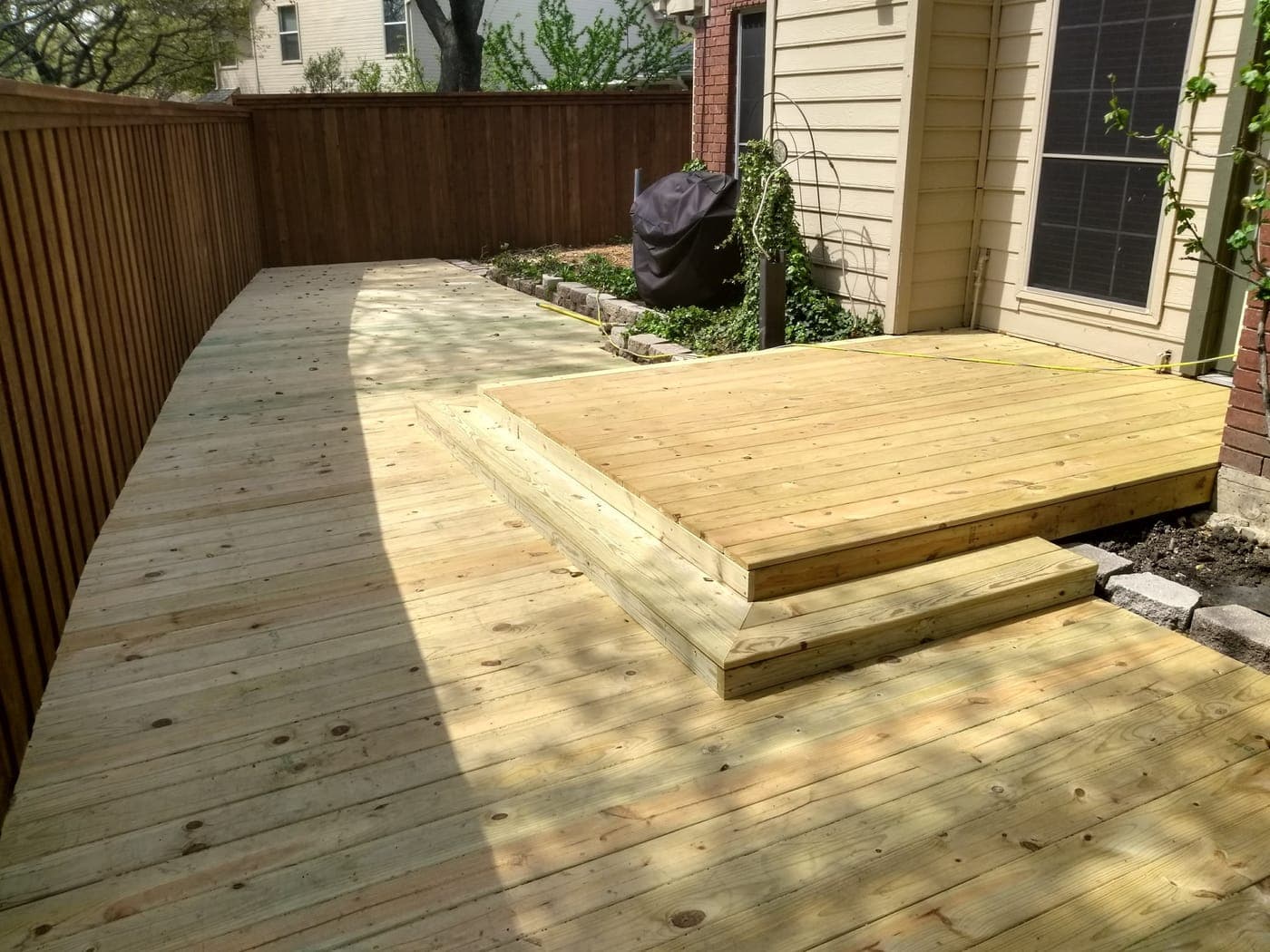 Multi-level cedar deck in McKinney, TX — step-down to lower platform