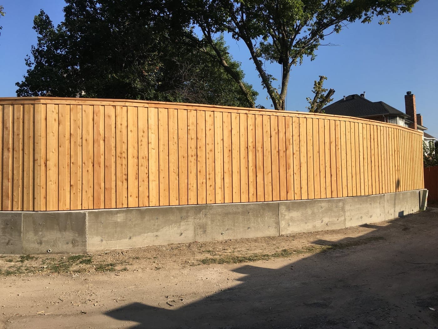 Cedar fence in Plano, TX — board-on-board with full-cap trim