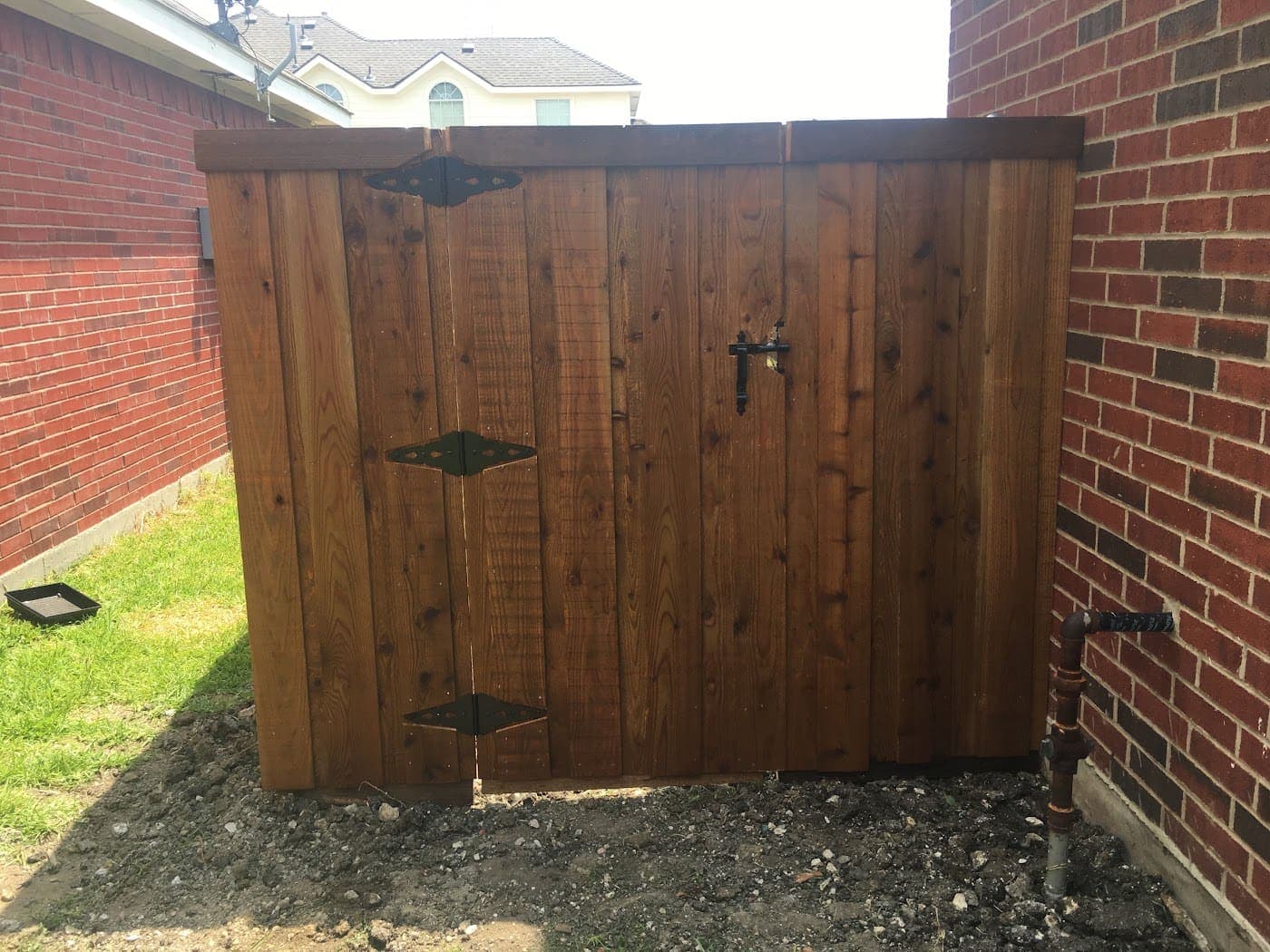 Cedar double gate with a heavy-duty black latch system