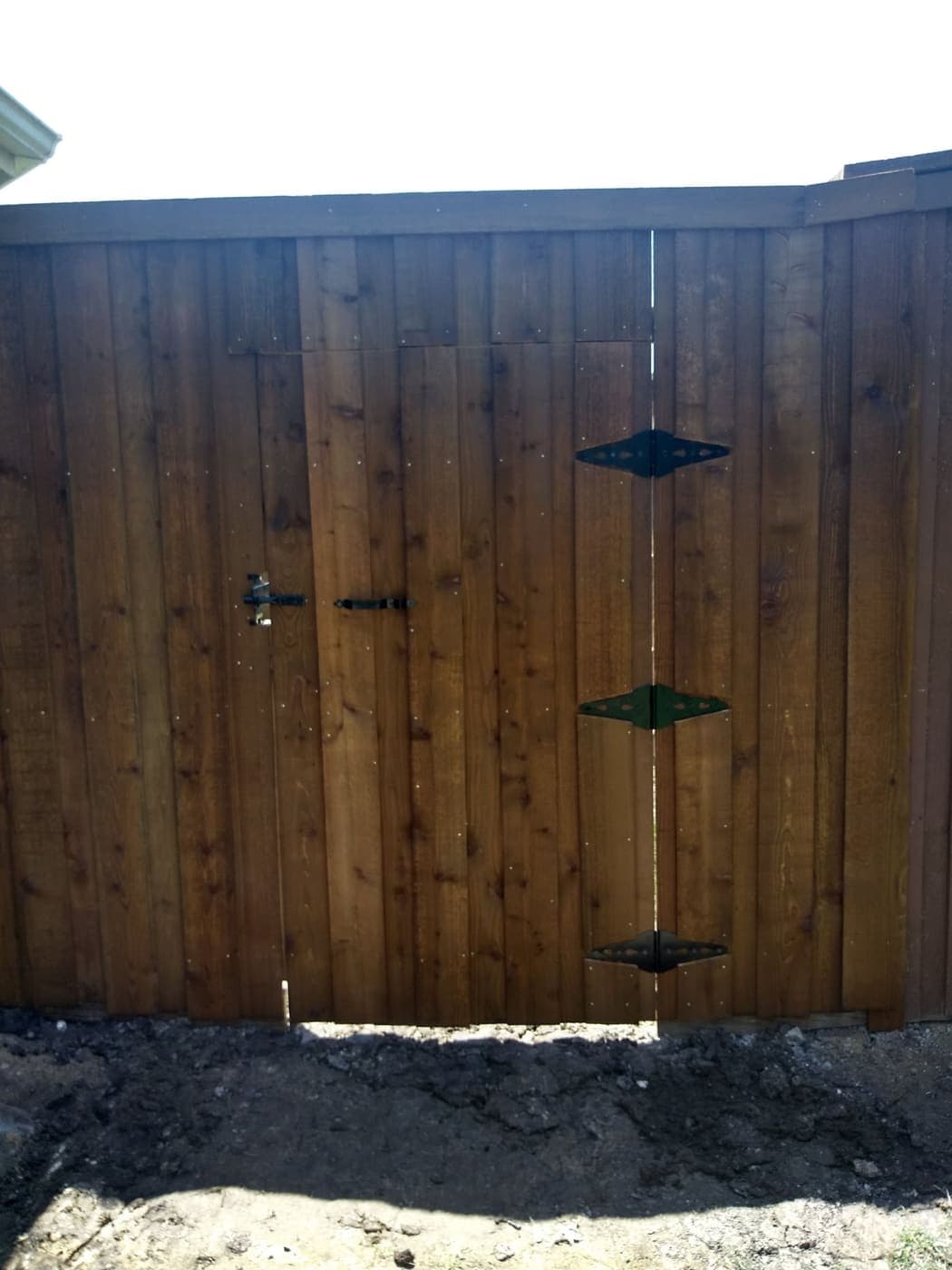 Cedar double gate with a heavy-duty latch, braced frame