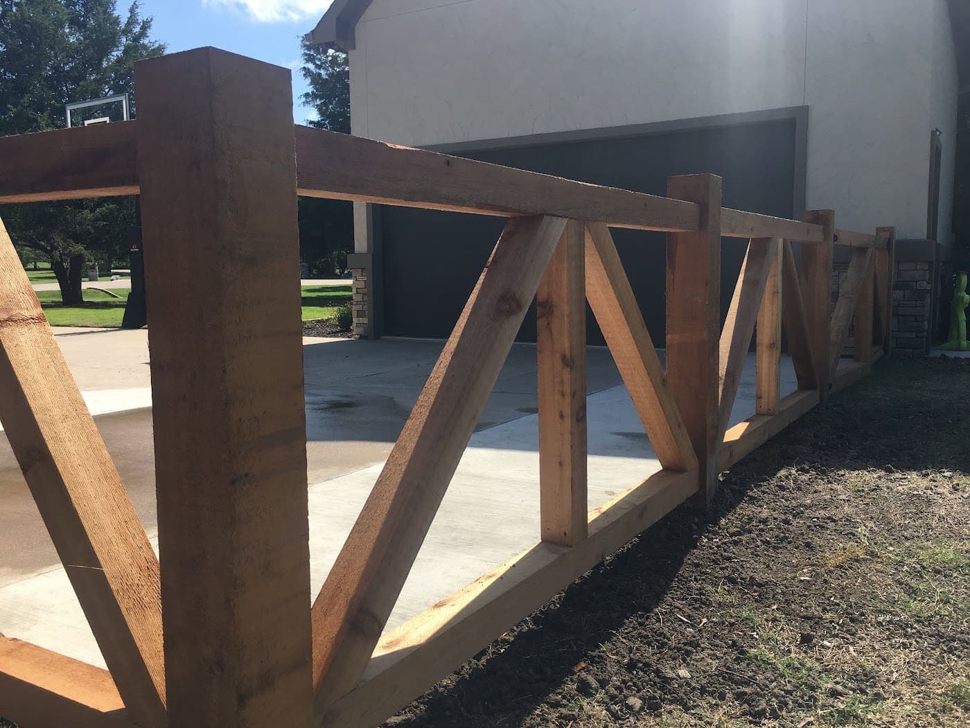 Cedar ranch-rail fence with cross bracing