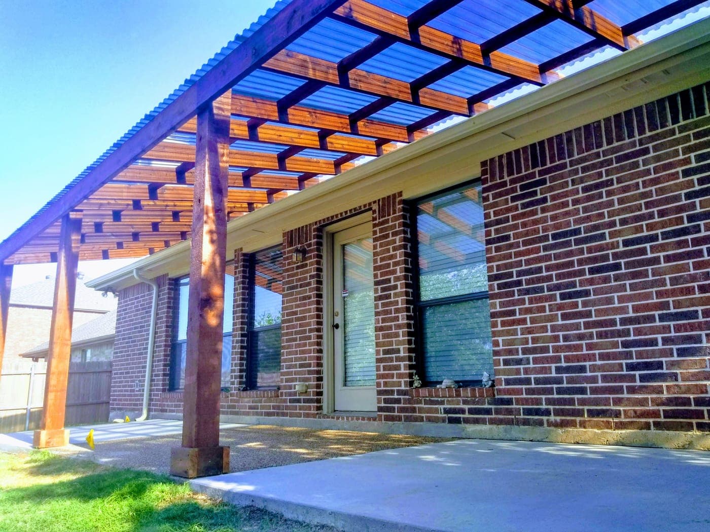 Cedar pergola in Allen, TX — over patio with hardware-concealed hangers