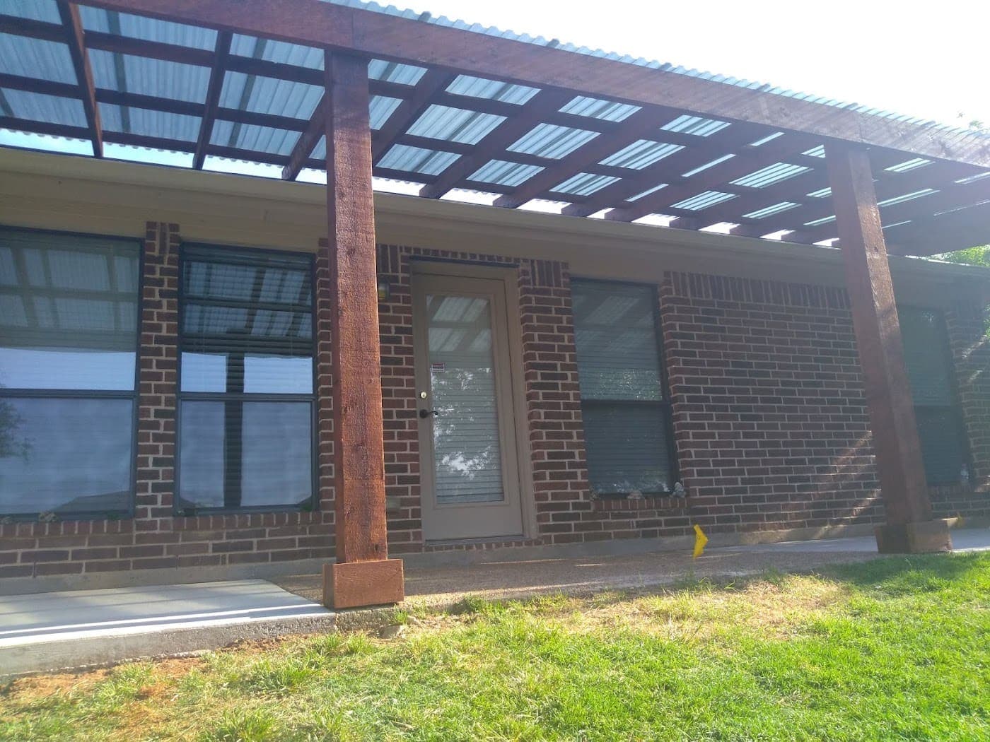 Cedar patio cover attached above a run of back windows