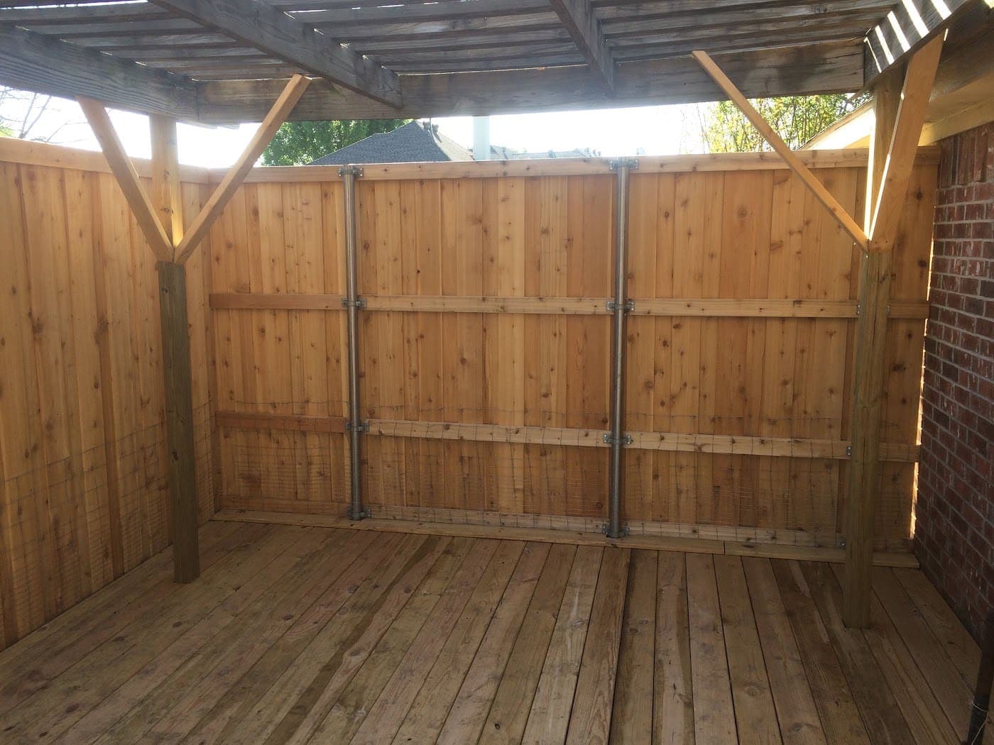 Covered deck under a cedar patio structure